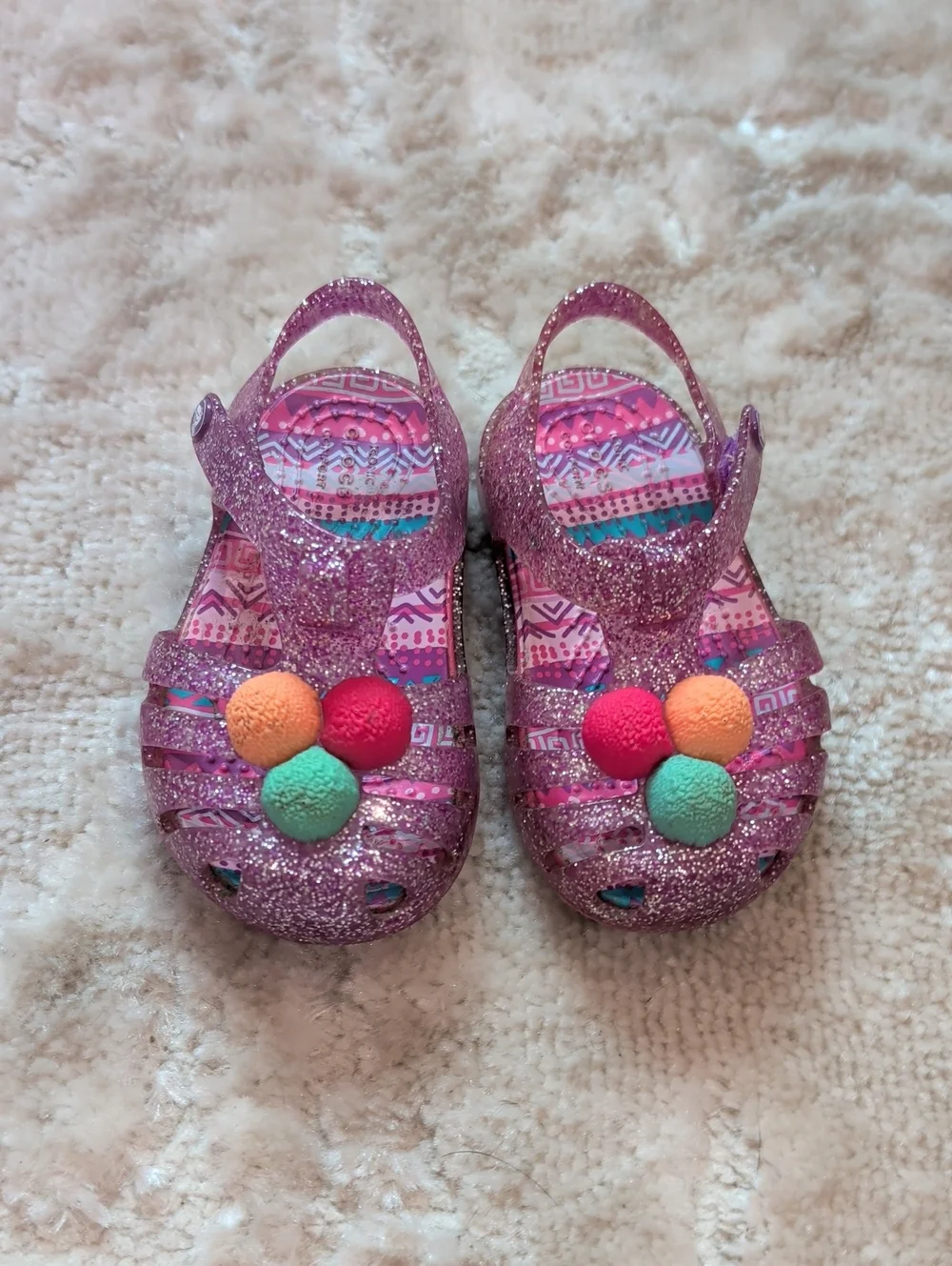 Toddler Glitter Jelly Sandals with Colorful Pom Accents - Pink Crocs